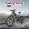An electric mountain bike is shown on a dirt road with mountains in the background. Produktbild-Vorschau