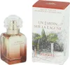 A perfume bottle and its packaging are displayed side-by-side against a white background. Voir les images du produit