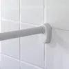 A close-up view of a white shower curtain rod mounted on white tiled wall. Podgląd zdjęcia produktu