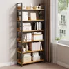 A multi-shelf bookcase filled with various items, placed against a wall next to a window with curtains. Produktbild-Vorschau