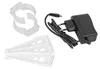 A collection of accessories for a lighting product, including clips, mounting brackets, and a power adapter. Podgląd zdjęcia produktu