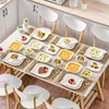 A dining table set for a meal with plates, cutlery, and food. Náhled obrázku produktu