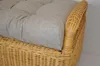 A close-up view of a cushion on a wicker chair. Produktbild-Vorschau
