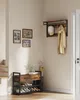 An entryway with a shoe rack, coat rack, and pictures on the wall. Náhled obrázku produktu