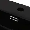 A close-up view of a black ceramic sink with a chrome-plated overflow ring and a faucet hole. Produktbild-Vorschau