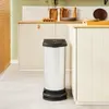 A white trash can with a black lid stands in a kitchen next to a cabinet. Voir les images du produit