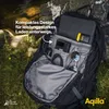 A backpack is open, showing its contents, placed outdoors on grass and rocks. Produktbild-Vorschau