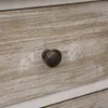 Close-up of a drawer knob on a wooden surface. Produktbild-Vorschau