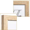 Close-up views of a wooden picture frame. Voir les images du produit