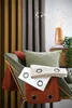A chair with pillows and curtains. Podgląd zdjęcia produktu