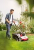 A man is using a lawn scarifier in a garden. Náhľad obrázku produktu