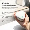 A hand holding a small white electronic device with a blue light on it, placed near a car window. Produktbild-Vorschau