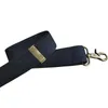 A close-up, angled view of a dark blue strap with a brass-colored metal clasp and a brass-colored metal hook attached to the end, against a white background. Anteprima dell’immagine prodotto