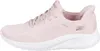 Side view of a pink Skechers slip-on sneaker with a white sole. Voir les images du produit