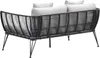 A back view of a modern outdoor sofa or daybed with a woven rope frame and light-colored cushions, set against a white background. Produktbild-Vorschau