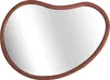 A mirror with an organic shape and a wooden frame. Anteprima dell’immagine prodotto