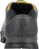 The back view of a black work shoe with yellow trim. Anteprima dell’immagine prodotto