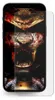 A smartphone with a screen protector applied, displaying a graphic of a bloody tiger's face and ornate armor. Produktbild-Vorschau