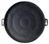 A top-down view of a black circular charcoal filter with concentric rings and two handle-like protrusions on the sides. Produktbild-Vorschau
