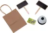 A collection of items for a play shop, including a paper bag, two small chalkboards, a credit card, and a bell. Náhled obrázku produktu