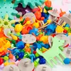 A pile of colorful building blocks and gears. Podgląd zdjęcia produktu