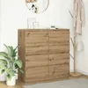 A wooden sideboard with eight drawers is shown in a room with a plant and a coat rack. Voir les images du produit
