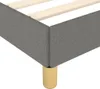 Close-up of a gray upholstered bed frame with wooden slats and gold legs. Anteprima dell’immagine prodotto