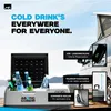 A portable cooler box filled with drinks, placed outdoors with a camper van in the background. Produktbild-Vorschau