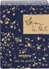 A close-up of a dark blue perfume box with gold speckles and handwritten-style text. Podgląd zdjęcia produktu