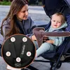 A woman is smiling at a baby sitting in a stroller. A close-up of the stroller's harness is shown with numbered indicators. Náhled obrázku produktu