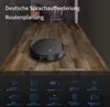 A black robot vacuum cleaner is shown on a wooden table, with text and icons detailing its features below. Náhled obrázku produktu