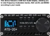 A close-up of a black radio receiver with a small screen displaying information and several buttons. Náhled obrázku produktu