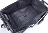 The interior of a black foldable wagon is shown against a white background. Produktbild-Vorschau
