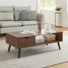 A living room scene with a couch and coffee table. Produktbild-Vorschau