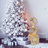 A decorated Christmas tree with gifts underneath and decorative gift boxes. Produktbild-Vorschau