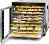 A food dehydrator with multiple trays filled with various fruits and herbs. Anteprima dell’immagine prodotto