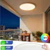 A modern LED ceiling light is shown installed on a balcony at dusk, with a city view in the background. Anteprima dell’immagine prodotto