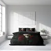 A bedroom scene with a bed featuring a skull and rose duvet cover. Produktbild-Vorschau