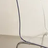A close-up view of the transparent seat and silver legs of a chair. Produktbild-Vorschau