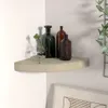 A corner shelf with decorative bottles and a plant. Náhled obrázku produktu
