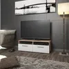 A modern living room with a TV stand, TV, armchair, and floor lamp. Náhľad obrázku produktu