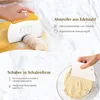 Two different types of dough scrapers are shown in use, one for cutting dough on a board and another for scraping dough from a bowl. Produktbild-Vorschau