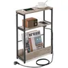 A narrow side table with integrated charging ports and a magazine rack. Náhled obrázku produktu