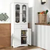 A white storage cabinet with glass doors and a drawer, filled with various items, is shown in a kitchen or bathroom setting. Anteprima dell’immagine prodotto