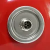 A close-up view of a metal fitting with multiple small openings on a red surface. Produktbild-Vorschau