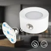 A product image showing a small white LED light with a magnetic base and a separate adhesive magnetic mount. Anteprima dell’immagine prodotto