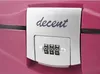 Close-up of a combination lock on a pink beauty case. Produktbild-Vorschau
