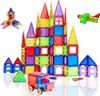 A collection of colorful magnetic building blocks arranged to form various structures, including a castle, a rocket, an airplane, houses, and a truck. Náhled obrázku produktu