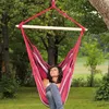 A woman relaxing in a hammock chair outdoors. Náhled obrázku produktu