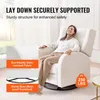 A woman is relaxing in a white recliner chair. Podgląd zdjęcia produktu